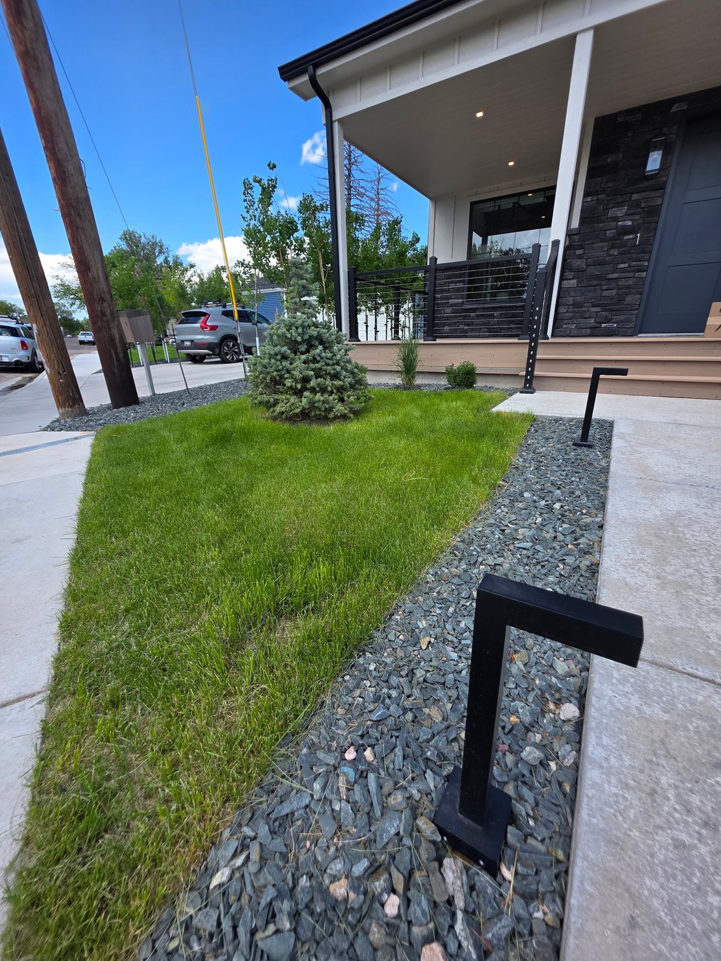 Modern home with fresh sod, spruce and decorative rock, Cheyenne Wyoming